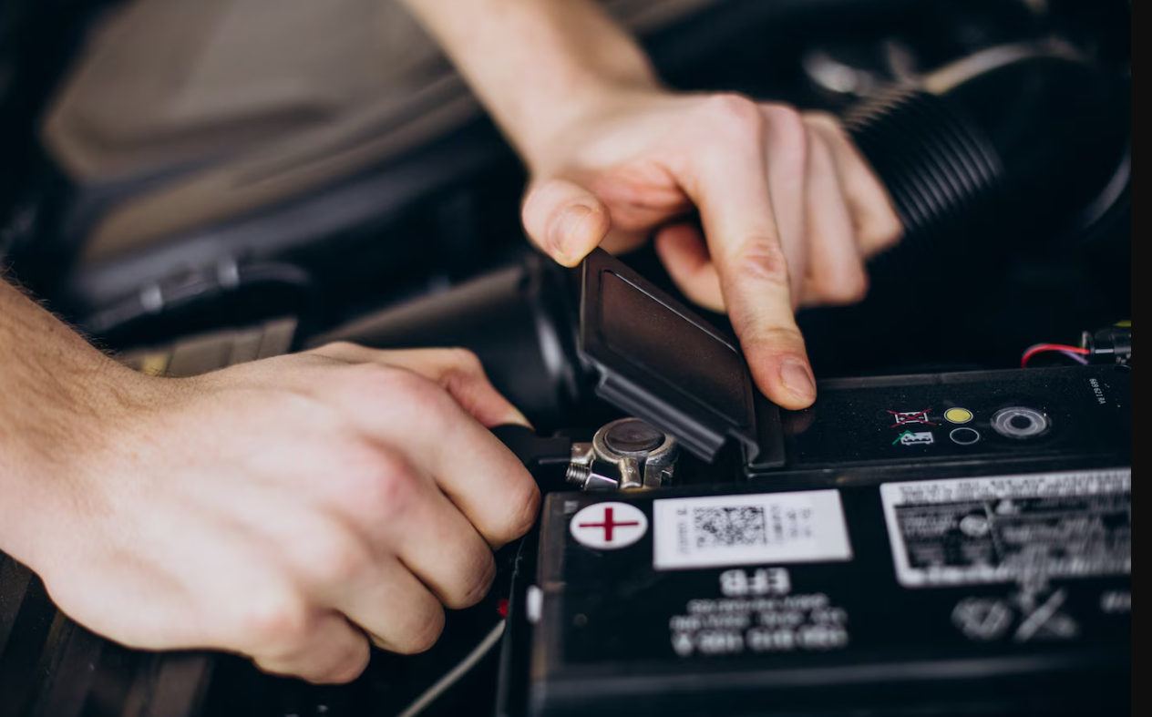 repair-man-making-car-service-battery